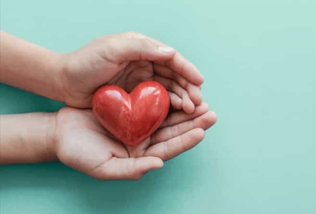 Hands holding heart